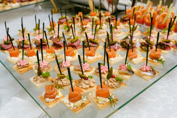 Catering - served table with various snacks, canape and appetize - Photo, Image