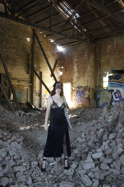 A portrait of a beautiful model in an abandoned warehouse.  - Φωτογραφία, εικόνα