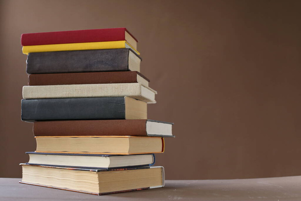 stack of books on wooden table - Photo, Image