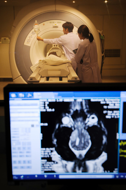Veterinarian doctor working in MRI scanner room - Fotó, kép