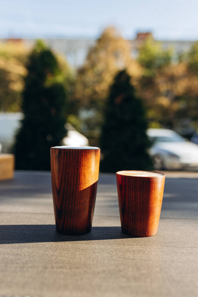 wooden cups of coffee on the table - Φωτογραφία, εικόνα