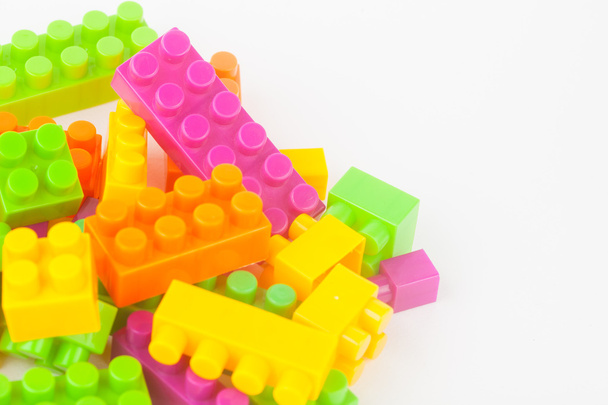 Toy building colorful blocks on white paper background - Photo, image