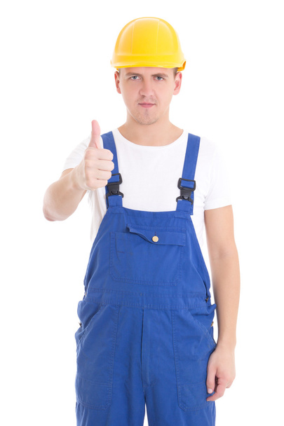 jovem bonito no Construtor azul uniforme sentido positivo isolado na - Foto, Imagem