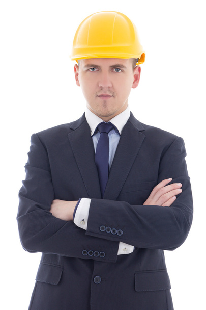 young handsome business man in yellow builder's helmet isolated  - Foto, Bild