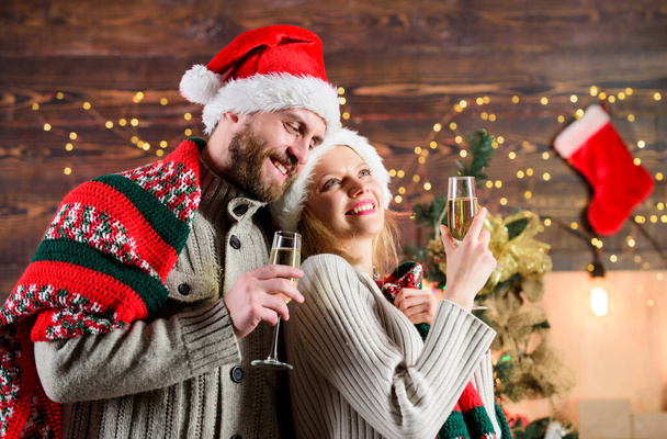 Make christmas wish. Couple in love cuddling enjoy christmas holiday celebration. Drinks for adults. Happy new year. Merry christmas. Celebrating christmas together. Home party. Festive atmosphere. - Foto, imagen