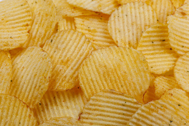 Lots of potato chips, texture close up - Foto, immagini