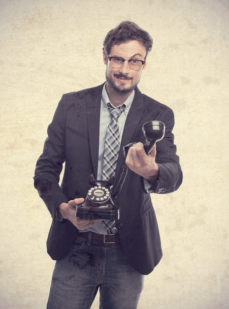 young crazy businessman offering a phone - Fotografie, Obrázek
