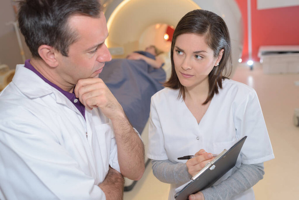 two doctors talking about mri results - Photo, Image