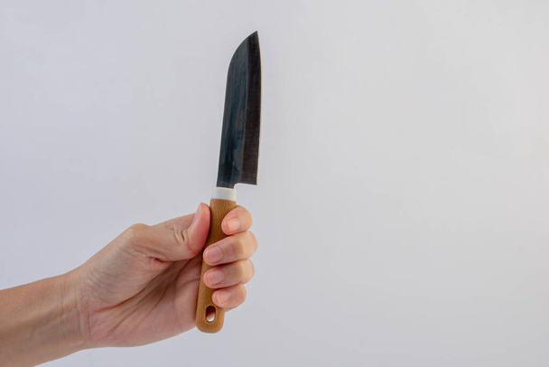 Hand and utility knife isolated on white background. - Valokuva, kuva
