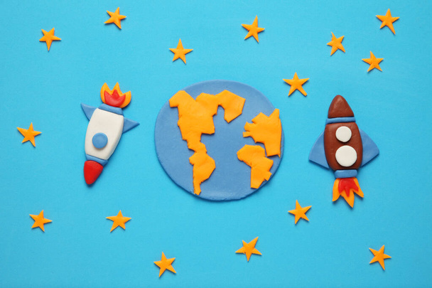 Two kid (child) rocket in space, adventure and science. Stars, and moon. Plasticine art, cartoon. - Фото, изображение