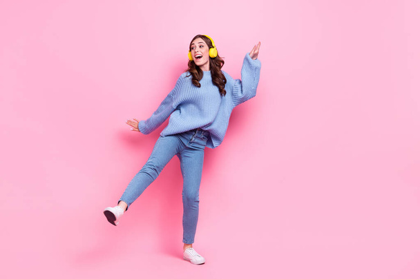 Full body photo of positive pretty lady have fun dancing listen music isolated on pink color background. - Zdjęcie, obraz