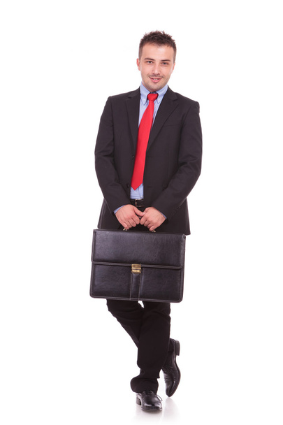 business man holding a black leather briefcase - Fotoğraf, Görsel