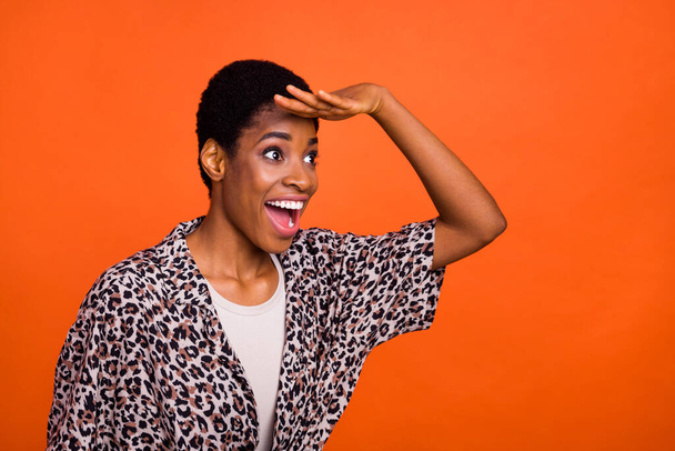 Profile portrait of shocked excited person hand forehead look empty space isolated on orange color background. - Fotó, kép