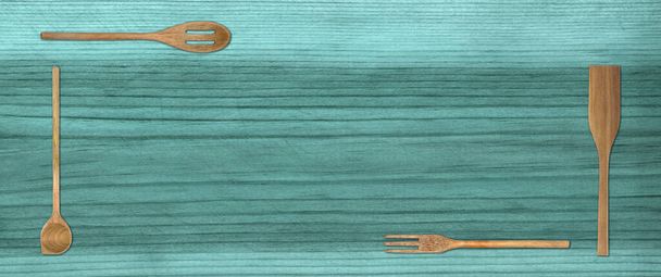 Topview of Set Cooking Wooden Utensils on Blue Table Background - Fotó, kép