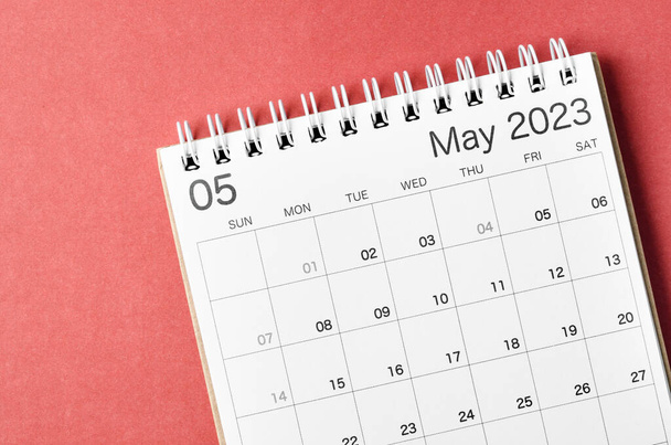 May 2023 calendar desk for the organizer to plan and reminder isolated on red background. - Photo, image