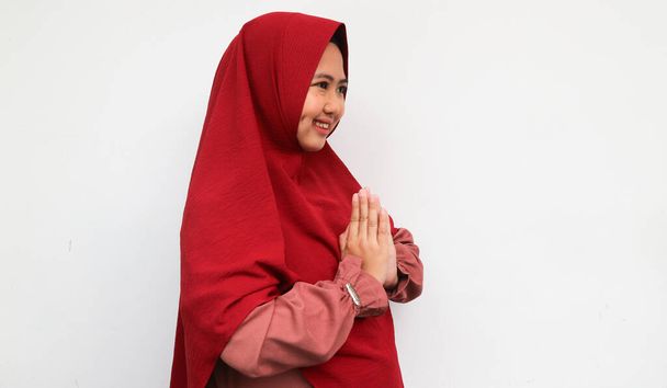 Portrait young beautiful Muslim woman wearing a hijab. Eid Mubarak greeting - Photo, Image