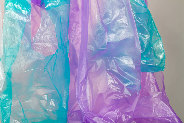 Close up blue and purple plastic bags. Plastic pollution concept. - Photo, Image