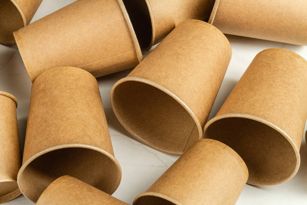 Many brown disposable empty paper cups. Containers for beverage. - Photo, Image