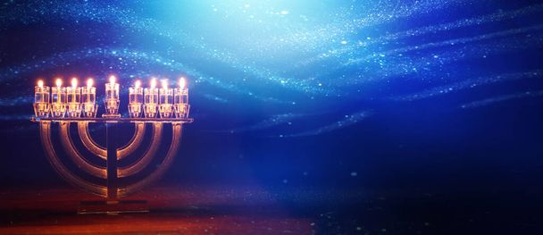Image of jewish holiday Hanukkah with menorah (traditional candelabra) and candles - Foto, Bild