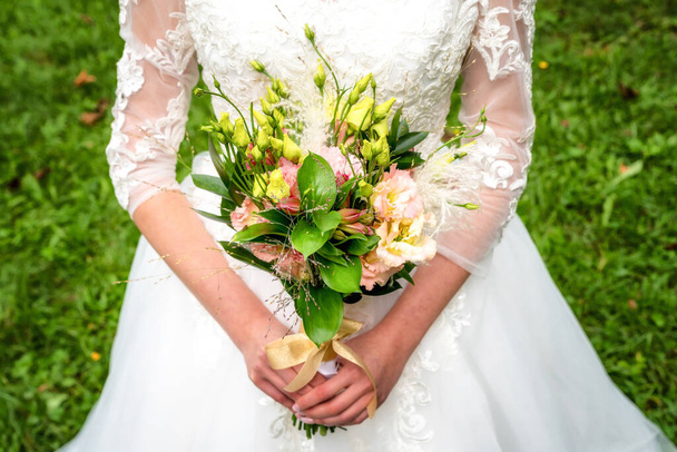 wedding bouquet in bride's hands. - Photo, Image