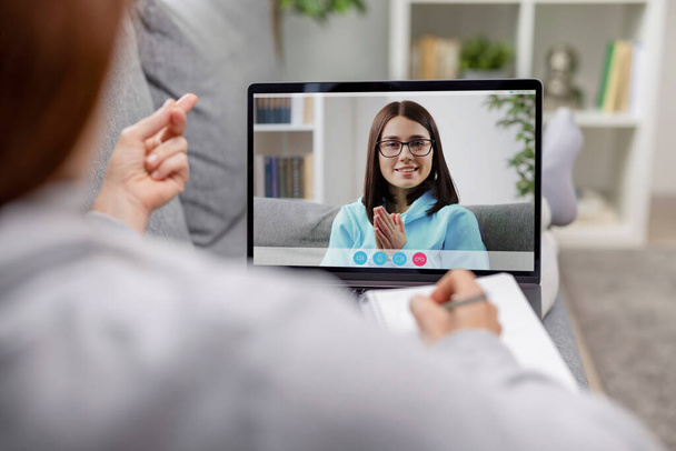 Videochat between two women, friends ladies have video call at leisure time, light living room interior, connection people concept - Photo, Image