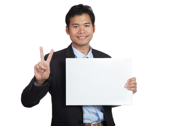 Asian businessman show OK sign with blank sign - Фото, изображение