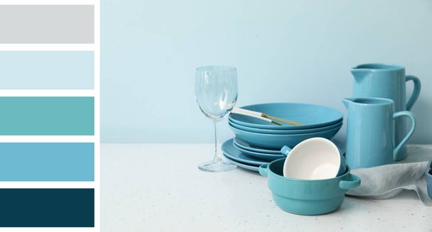 Set of stylish clean tableware on light background. Different color patterns - Photo, Image