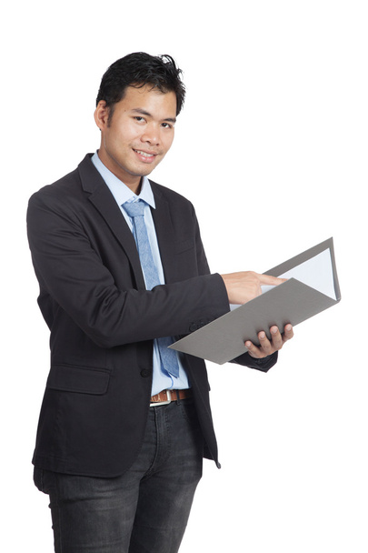 Asian businessman point to a folder and smile - Zdjęcie, obraz