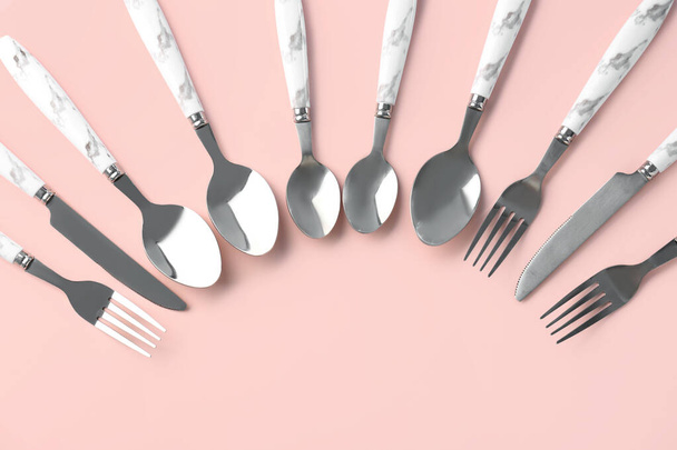 Silver cutlery on pink background - Photo, Image