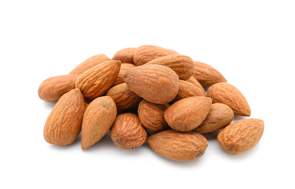 Pile of tasty almonds on white background - Photo, Image