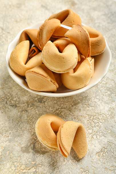 Bowl of fortune cookies on grunge background, closeup - Photo, Image