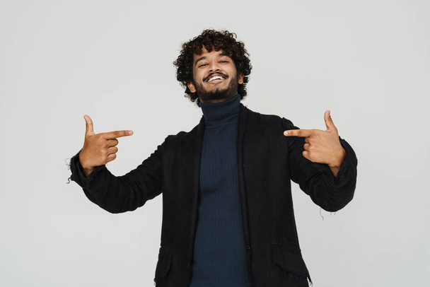 Adult young indian man smiling and pointing fingers on himself over isolated grey background - Photo, image