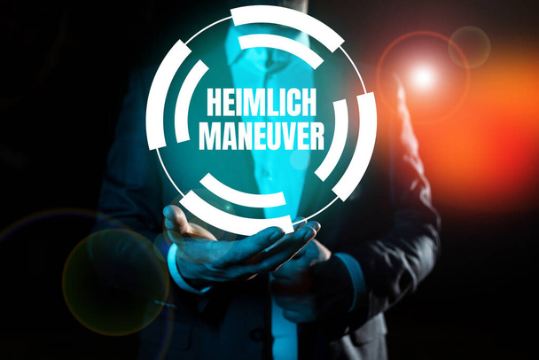 Texte inspirant Heimlich Maneuver, Photo conceptuelle de l'application de la pression ascendante en cas d'étouffement - Photo, image