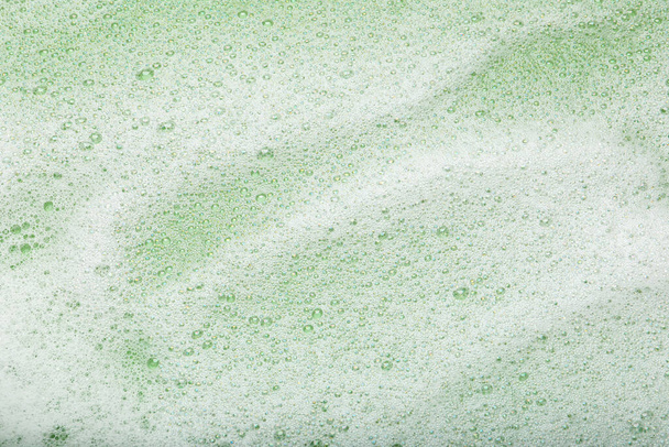 White washing foam on olive background, top view - Photo, Image