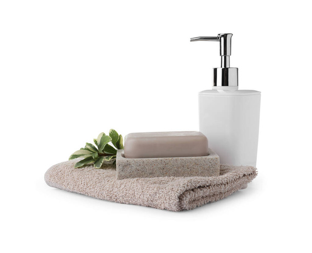 Dish with soap bar, dispenser and terry towel on white background - Фото, зображення