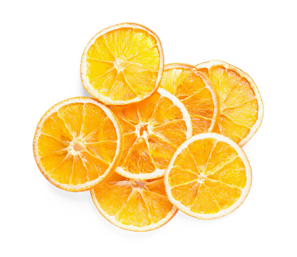 Delicious dry orange slices on white background, top view - Foto, imagen