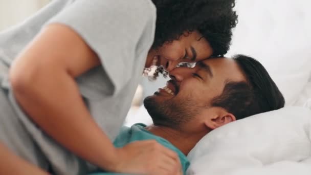 Love, funny and playful with a black couple in bed together, enjoying an intimate moment in their home. Comic, bedroom and time with a man and woman bonding in romance with comedy or laughter. - 映像、動画
