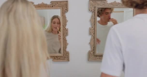 Singing, playful and dance couple brushing teeth, dental health and mirror reflection in the bathroom. Healthcare, wellness and dancing man and woman with toothpaste and toothbrush in the morning. - Footage, Video