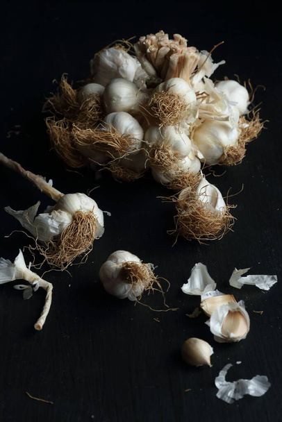 Group of garlics on a black background - Фото, зображення