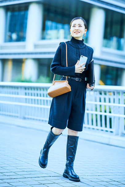 Asian fashionable business woman portrait outdoors - Photo, Image