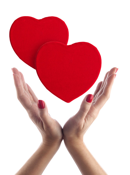 Red hearts in hands - Фото, зображення