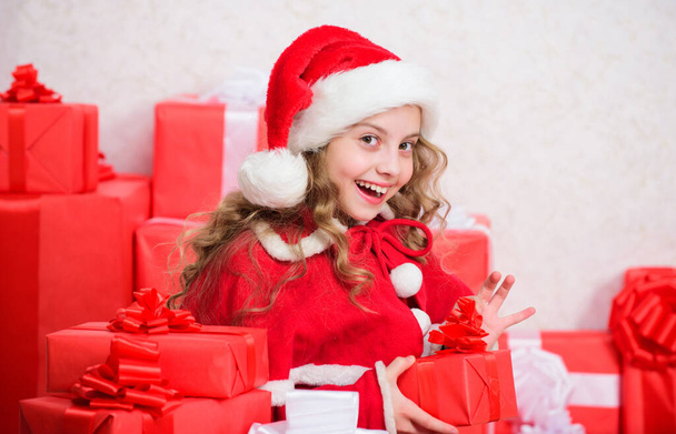 New year holiday tradition. Kid excited about opening christmas present. Girl celebrate christmas. Santa bring her gift. Winter happiness concept. Explore christmas gifts. Unpacking christmas gift. - Fotó, kép