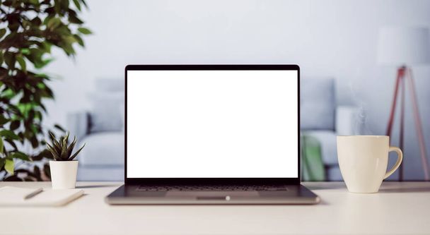 Современный ноутбук с чистым белым экраном для замены копий, уютный интерьер домашнего света с чашкой парящего кофе - Фото, изображение