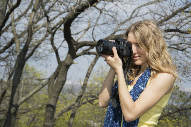 Spring in the park girl photographer. - Photo, Image