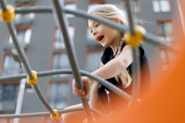Happy child on the playground, active lifestyle. - Фото, зображення
