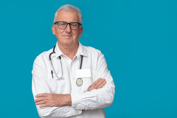 Doctor in eyeglasses on turquoise background with space for text. - Photo, Image