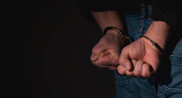 Arrested man in handcuffs  - Foto, Bild