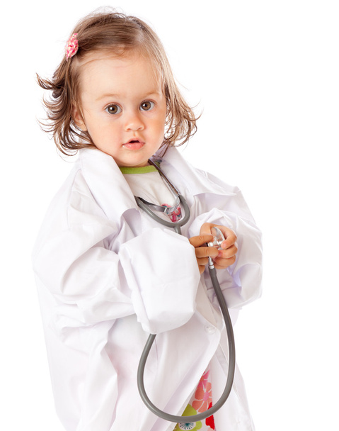 A little girl is playing as a doctor - Фото, зображення