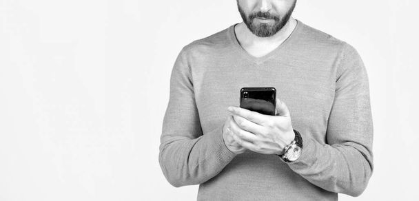 cropped man with beard chatting online on smartphone, copy space, chat. - Photo, Image