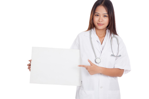 Young Asian female doctor point to a blank sign - Φωτογραφία, εικόνα